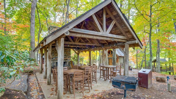 A rustic wooden pavilion with tables and chairs, surrounded by trees with autumn foliage. - Hike & Ski: Mtn-View Gem w/ Balcony in Burnsville! (Burnsville)