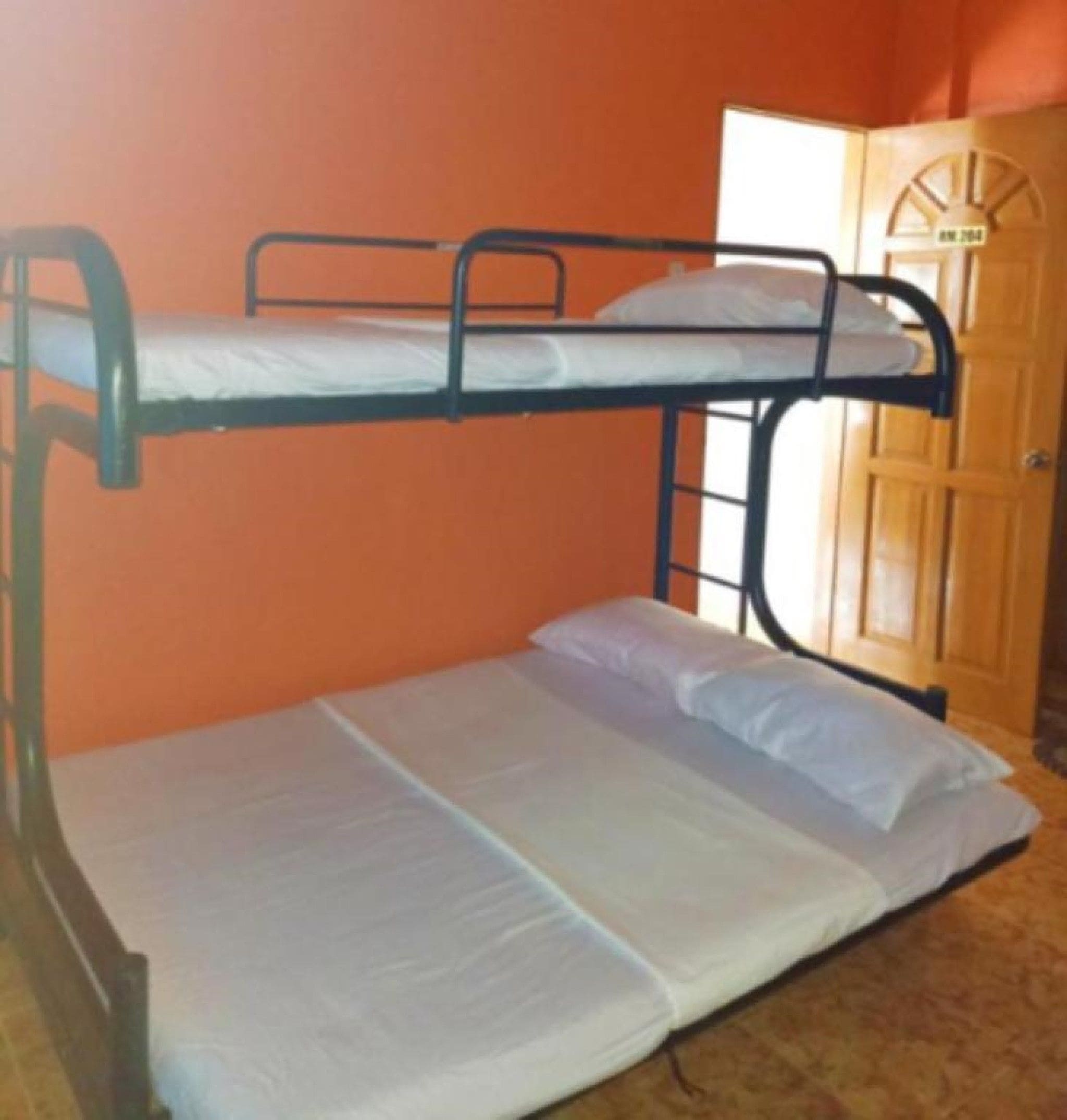 A bunk bed with a lower bunk and a single bed.
