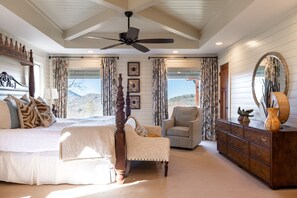 A bedroom with a large bed, a chair, a dresser, and a ceiling fan. - Elevation 4118 - an amazing 5 STAR LUXE mountain retreat in Highlands/Cashiers (Highlands)