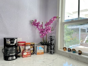 Enjoy a cup of coffee while taking in the view from this kitchen, equipped with a coffee maker and coffee pods.