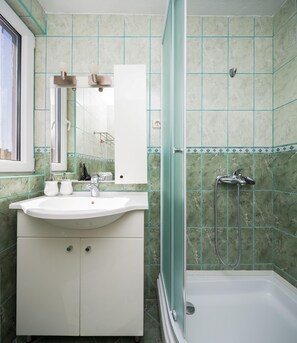 Apartment, 1 Queen Bed with Sofa bed | Bathroom | Shower, hair dryer, towels