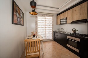 Private kitchen - Luxurious Apartment in Sidi Bou Zid With Garden View (Nouaceur)