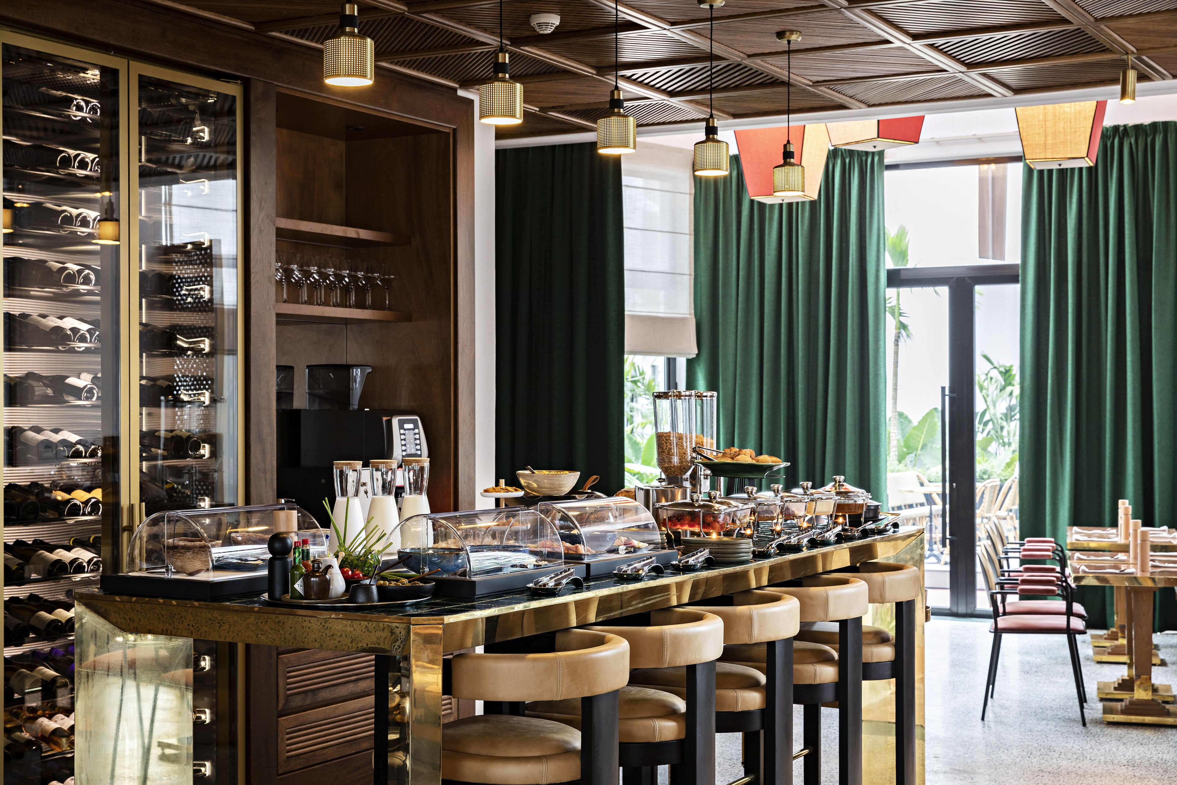 A bar area with a wine rack, seating, and a buffet.