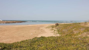 On the beach, sun loungers, beach towels