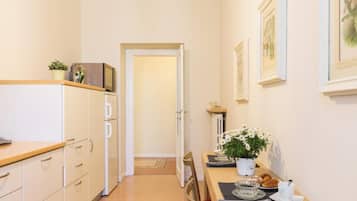 City Apartment | Living area | 30-inch TV with digital channels