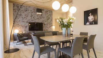 City Apartment | Living area | 30-inch TV with digital channels