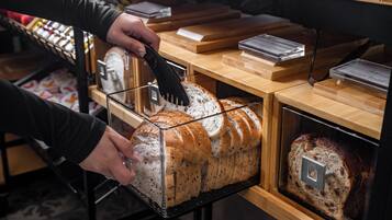 A loaf of bread in a glass display case.
