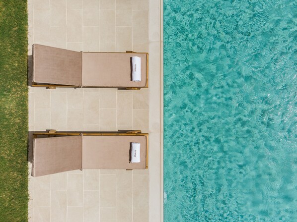 Seasonal outdoor pool, pool loungers