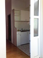 Apartment, 1 Queen Bed | Private kitchen | Fridge, stovetop, electric kettle