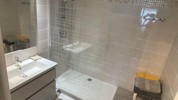 Shower, hair dryer, towels, soap