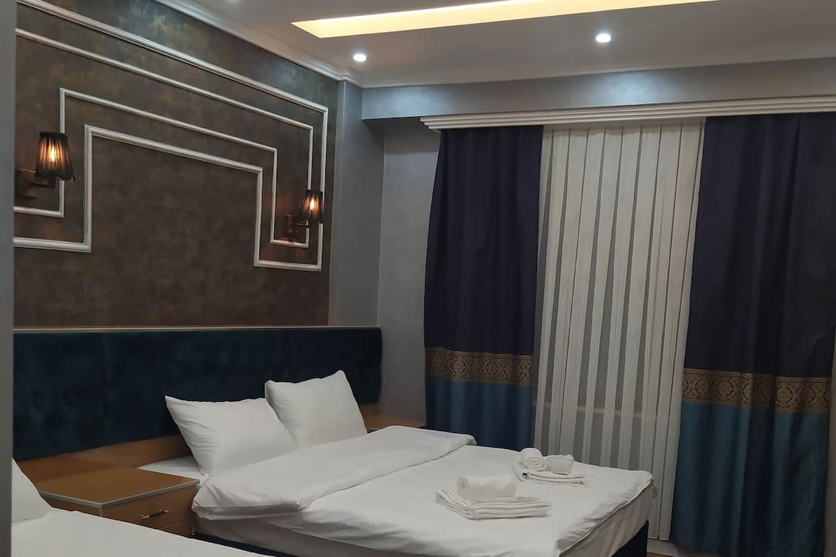 Chambre Quadruple Familiale | Literie de qualité supérieure, minibar, coffres-forts dans les chambres