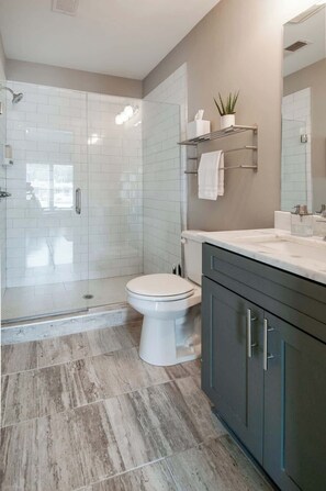 Shower, hair dryer, towels, shampoo
