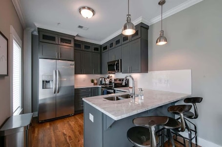 Fridge, microwave, oven, stovetop. New Nashville Condo with 2 King beds, walk to bars