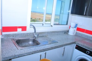 Fridge, cookware/dishes/utensils, dining tables
