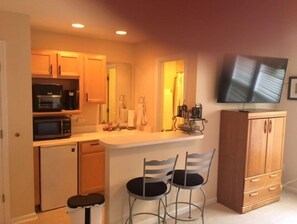Fridge, microwave, toaster, cookware/dishes/utensils