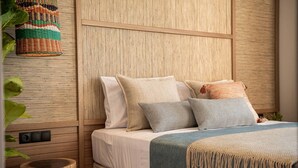 A bed with multiple pillows, a wooden headboard, and a wall-mounted power outlet. - Sea View Villa w/Private Pool, 400m to the beach (Heraklion, Crete)