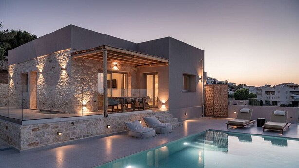 A modern house with a swimming pool, stone walls, and outdoor seating. - Sea View Villa w/Private Pool, 400m to the beach (Heraklion, Crete)