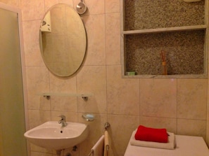 A bathroom with a sink, mirror, and window. - A3 - apt w. Patio, 3 min Walking From the Beach (Dugi Rat)