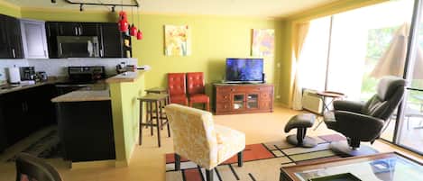 A compact living space with a kitchen, dining area, and seating area.