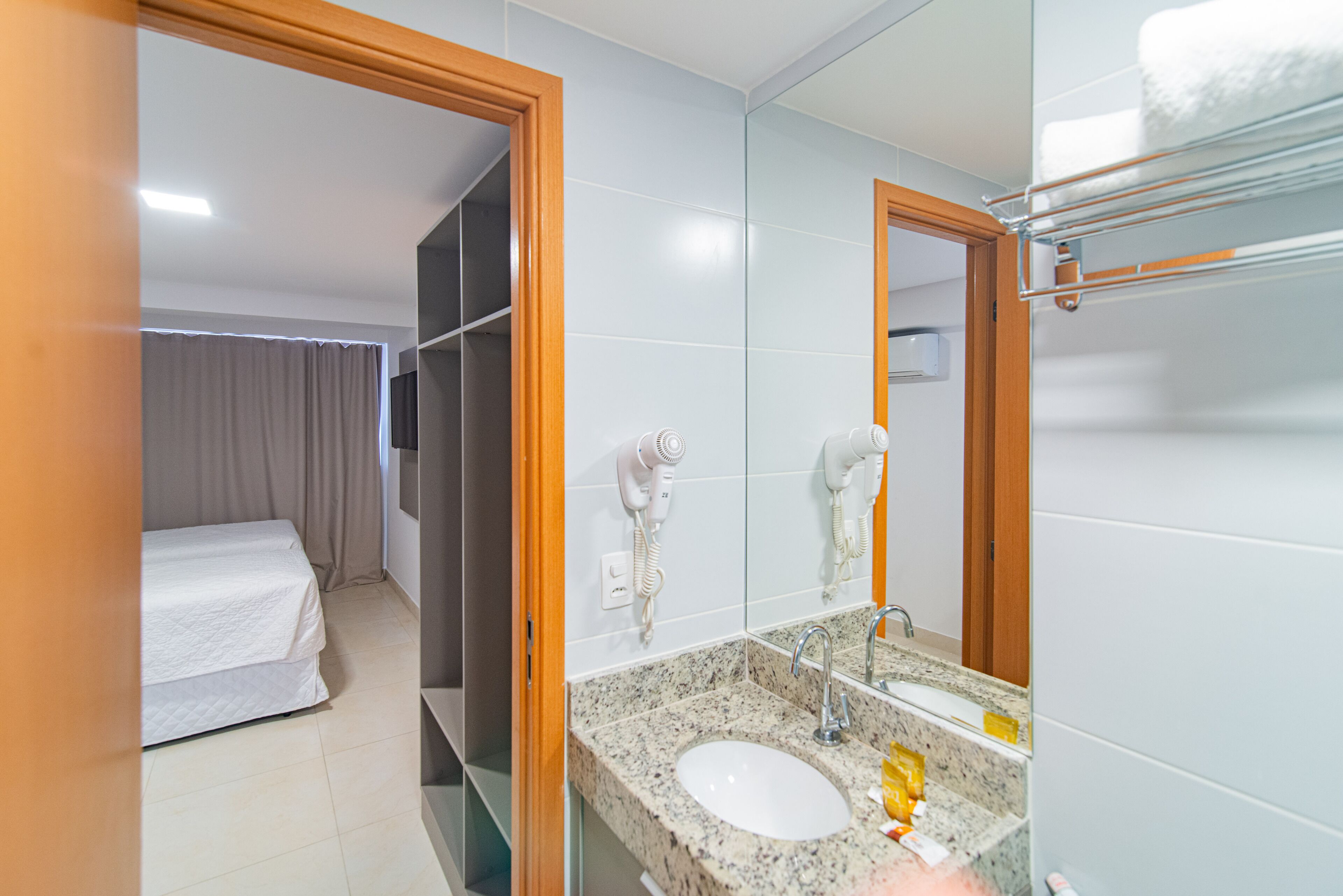 economy twin room | bathroom | rainfall showerhead, hair dryer, towels, soap