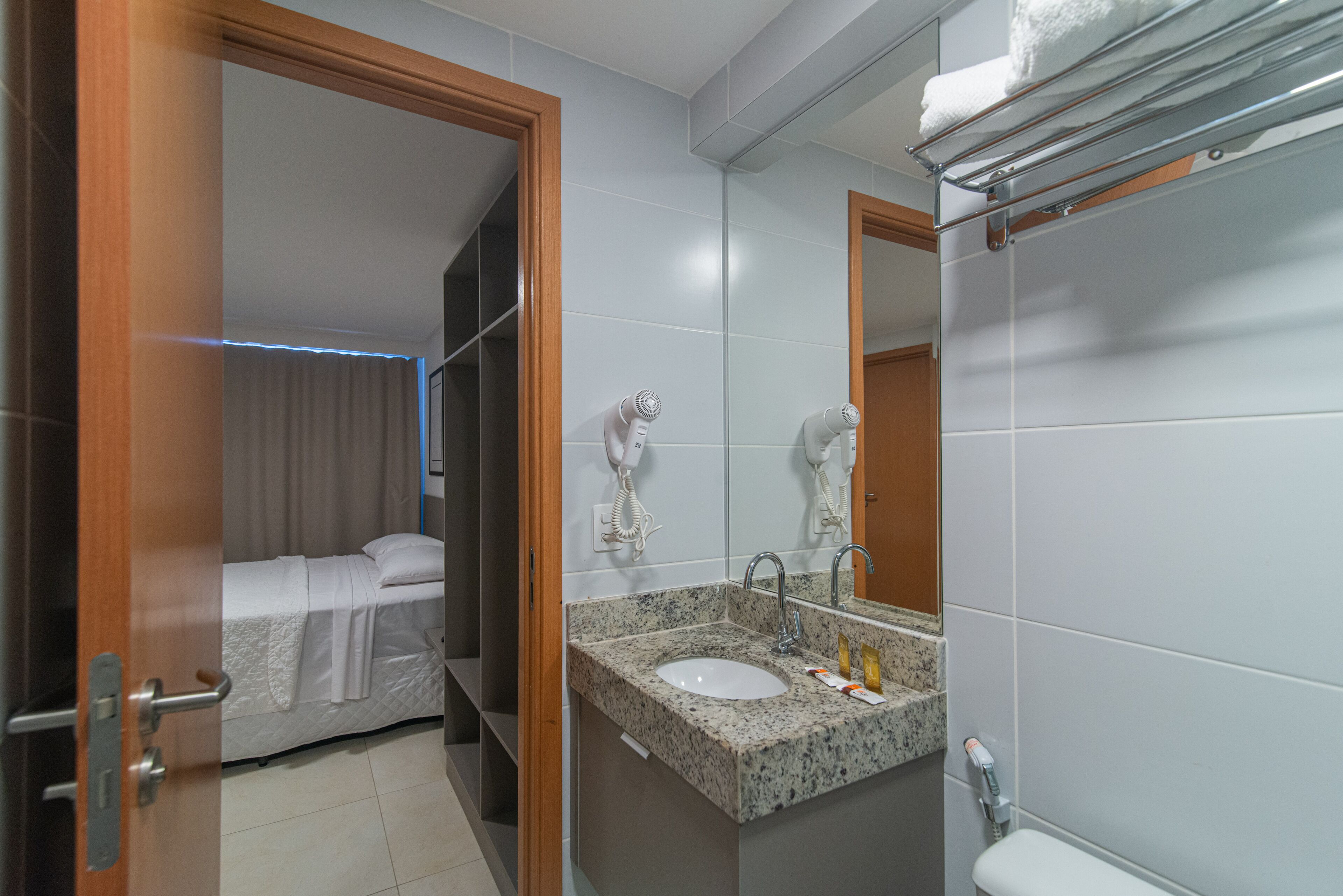 rainfall showerhead, hair dryer, towels, soap