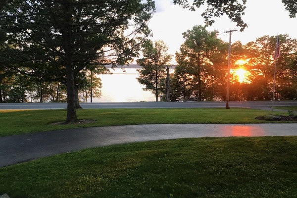 A short walk from the front yard, cross road, staircase to private lake area.