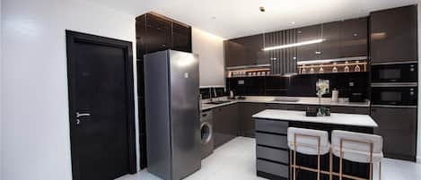 Fridge, microwave, stovetop, coffee/tea maker