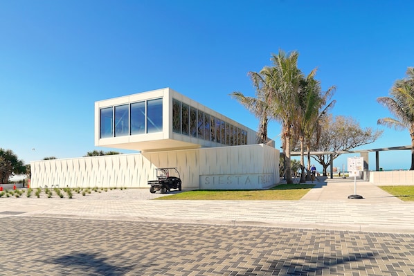 A modern building with a flat roof and large windows, labeled "SIESTA BEACH".