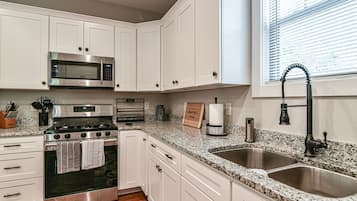 Oven, dishwasher, spices, dining tables