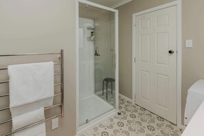 Bathtub, hair dryer, towels, soap