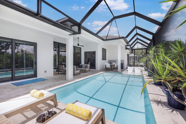 A heated pool, pool loungers