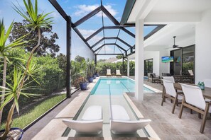 A heated pool, sun loungers