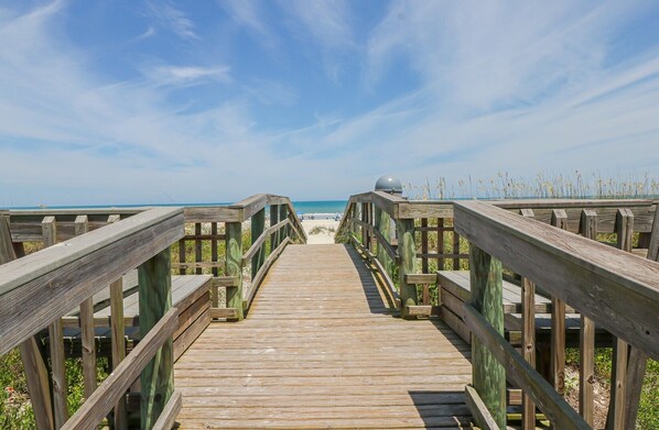 Walk along the boardwalk to the ocean and enjoy the view of the sandy shore.