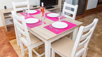 City Apartment (Top Center) | Living area | Flat-screen TV