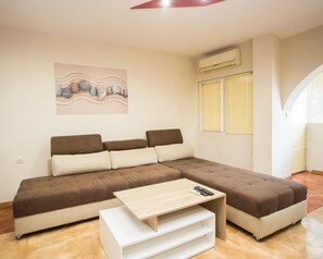 City Apartment (Top Center) | Living area | Flat-screen TV - Aleksapart (Burgas)