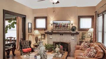 Smart TV, fireplace, books, offices