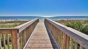 A wooden boardwalk leading to a beach with clear skies. - 5-Star Luxury, Fully Updated OCEANFRONT 2 Bed/ 2 Bath FALL STAYS 50% OFF RESORT! (Myrtle Beach)