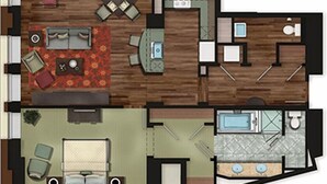 A hotel layout with a living area, dining space, kitchen, bathroom, and a bedroom.