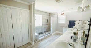 Combined shower/tub, hair dryer, towels, toilet paper