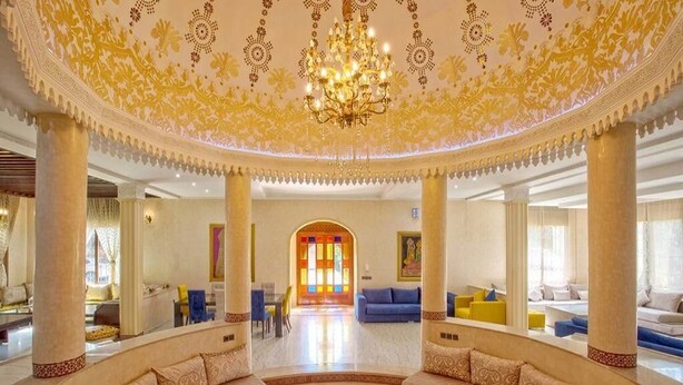 A luxurious lobby with ornate ceiling designs, a grand chandelier, and a central seating area with sofas and a coffee table. - High standing villa with swimming pool 5231 (Marrakech)