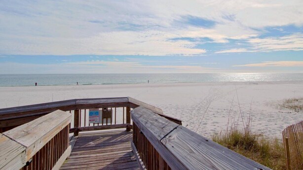 A wooden boardwalk leading to a beach with a clear view of the ocean. - Beautiful Ocean Views 2/2 Condo  (Orange Beach)