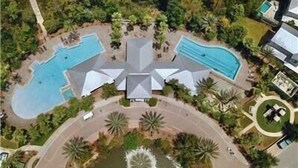 An aerial view of a resort with multiple swimming pools, a central building, and landscaped areas. - 6 Seater Golf Cart, 5 Bikes! Zero Entry Pool & Beach! - Cool Your Jets at NatureWalk on 30A (Santa Rosa Beach)