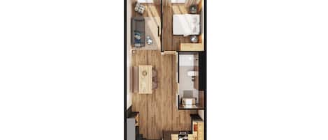 A top-down view of a compact hotel room with a wooden floor, a sofa, a bed, a small table, and a kitchenette.
