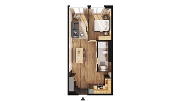 Vista desde arriba de una habitación de hotel compacta con piso de madera, un sofá, una cama, una mesita y una kitchenette.