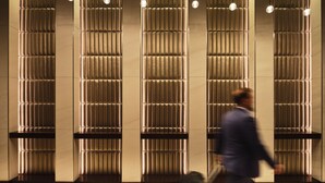 A modern interior with vertical paneling and recessed lighting. - AC Hotel by Marriott Jackson Ridgeland (Ridgeland)