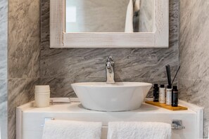 Shower, hair dryer, towels, toilet paper