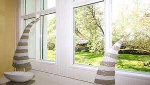 Two striped decorative objects on a windowsill.