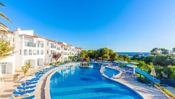 Seasonal outdoor pool, open 3:00 PM to 7:00 PM, pool umbrellas