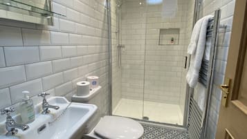 Shower, towels, soap, toilet paper