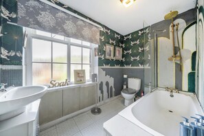 Combined shower/bathtub, deep-soaking bathtub, hair dryer, towels